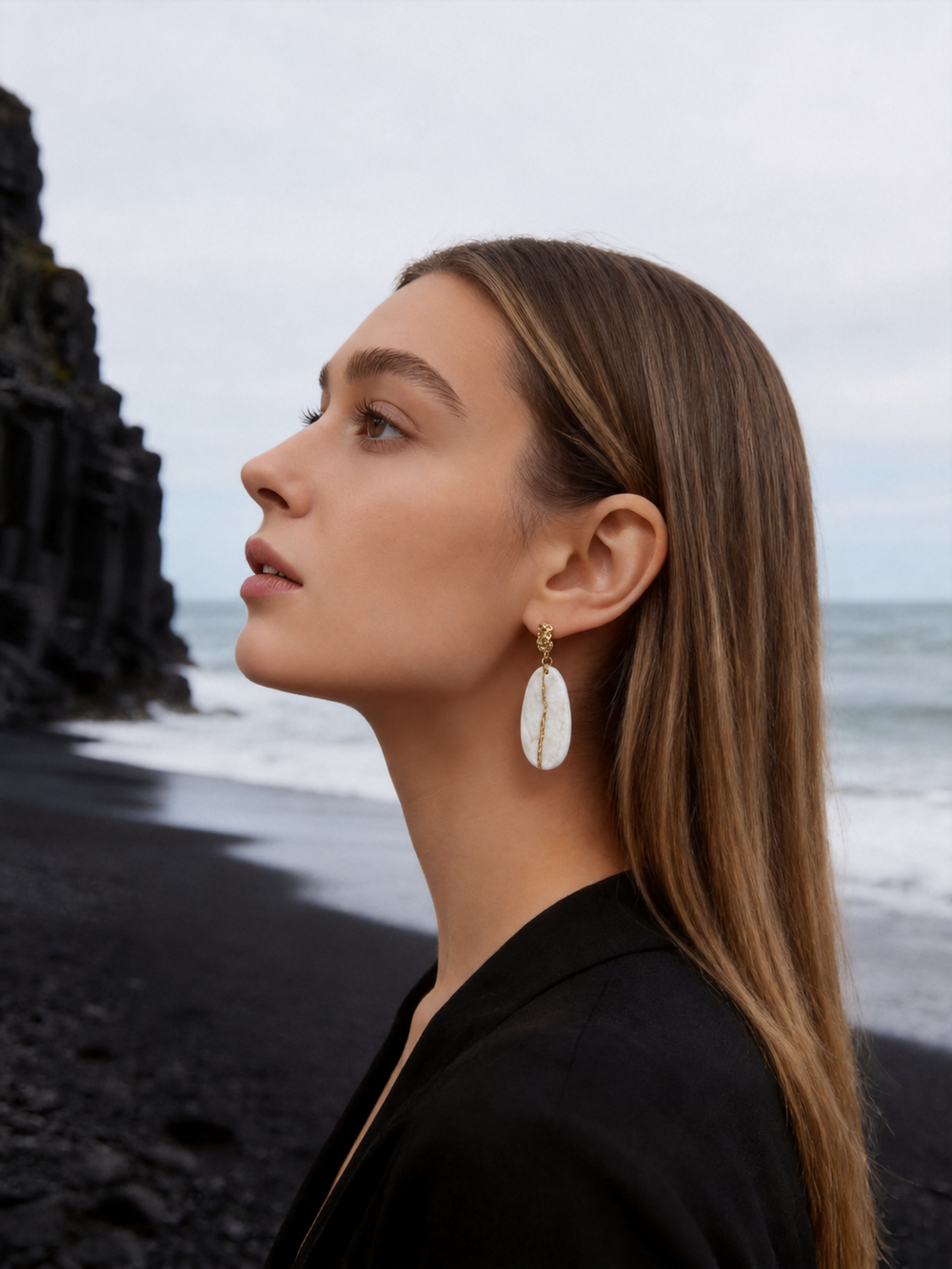 Profile view of ZELIN ART jewelry worn by model
