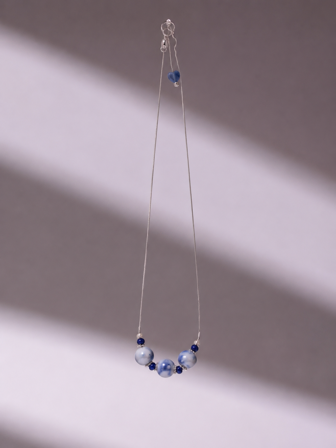 Blue porcelain earrings product still life