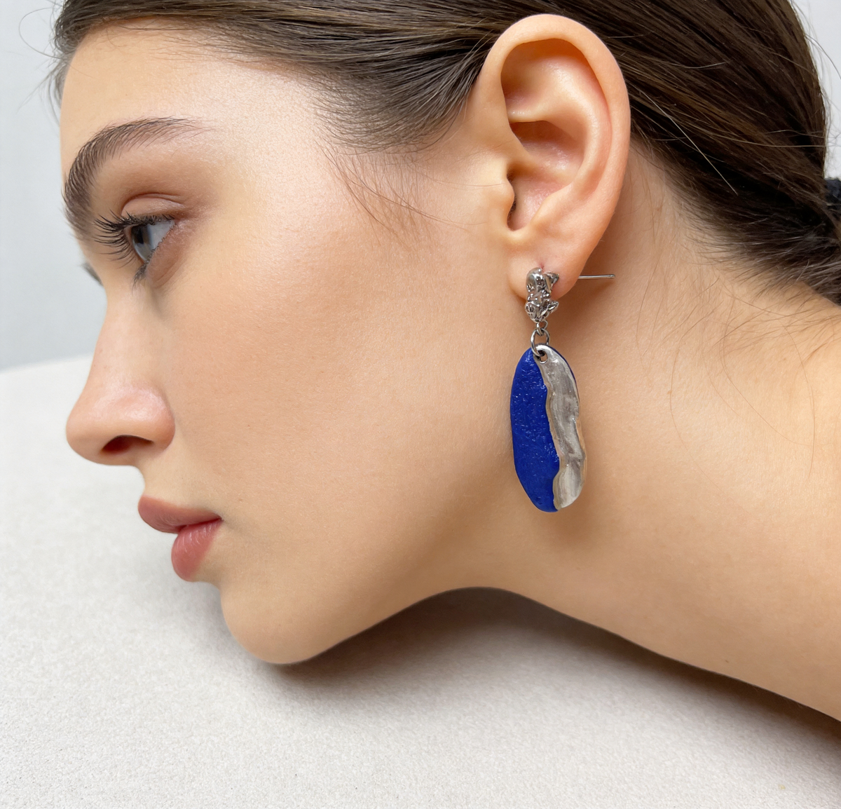 ZELIN ART jewelry worn close to the body